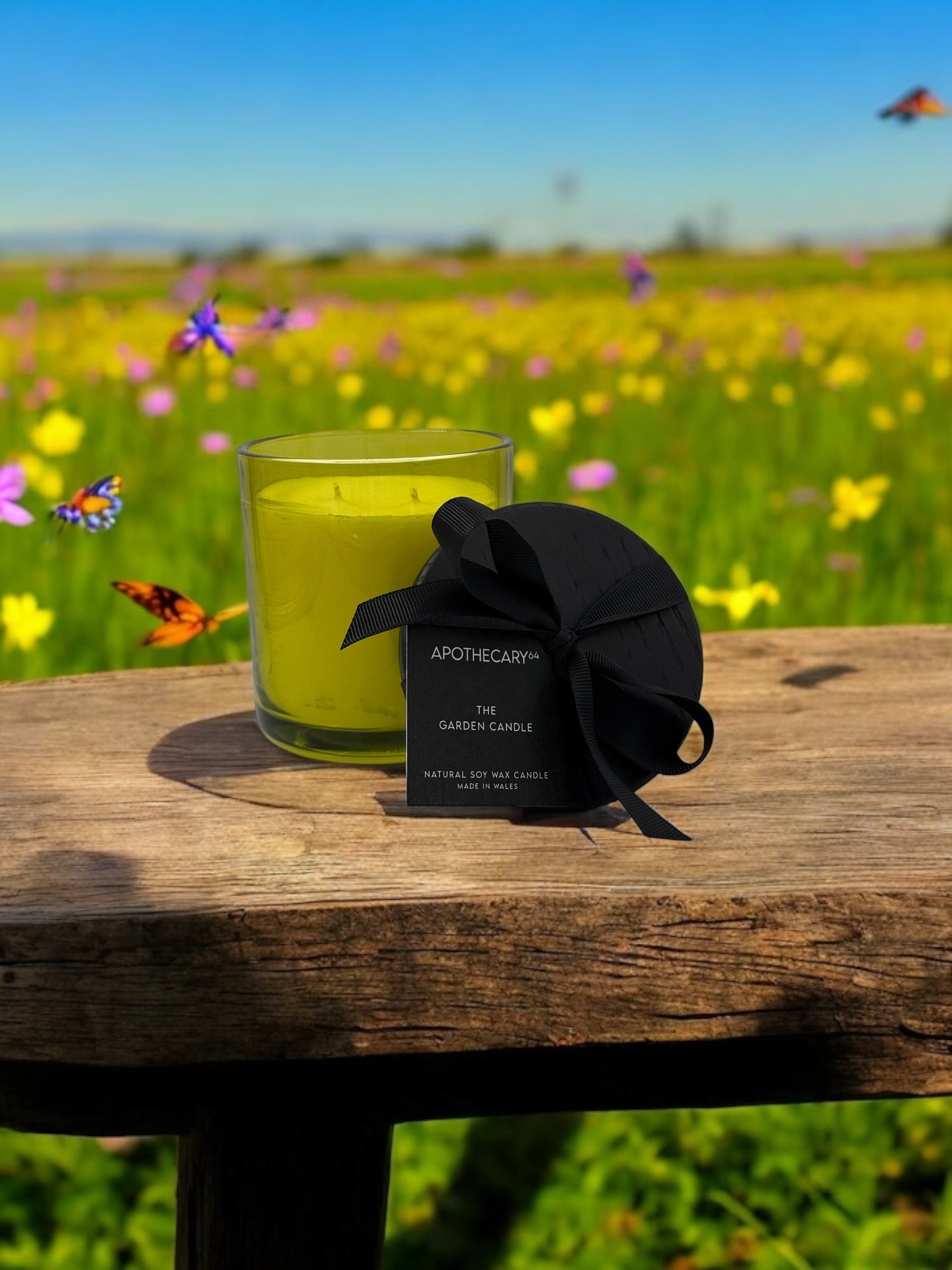 "Hand-poured Garden Candle in amber jar on white table"